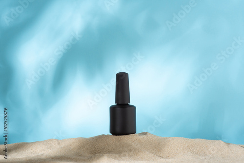 Black nail polish on the sand