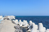 The blue sea under the blue sky as seen from the breakwater on a fine day. horizon