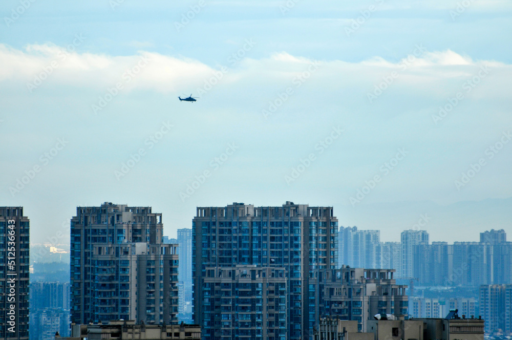 Naklejka premium skyscrapers and plane in the city