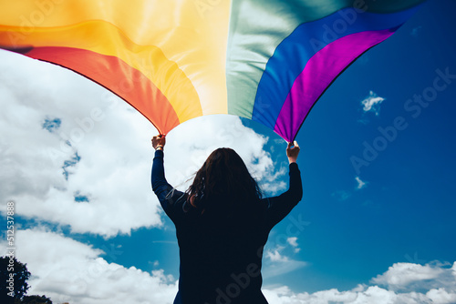 Young woman with LGBT flag.