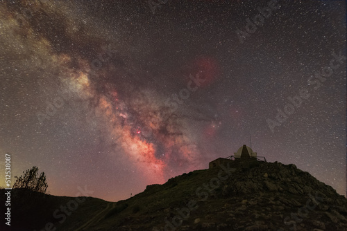 Fotografija Milky Way core above hilltop lookout tower
