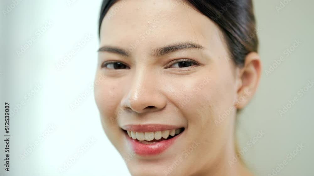 Portrait happy moment of young woman look at camera. Close up beautiful lady smiling slow motion shots. Portrait happy moment of young woman look at camera. Close up beautiful lady smiling slow motion shots.