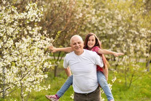 Grandfather And granddaughter on flower farm © Angelov