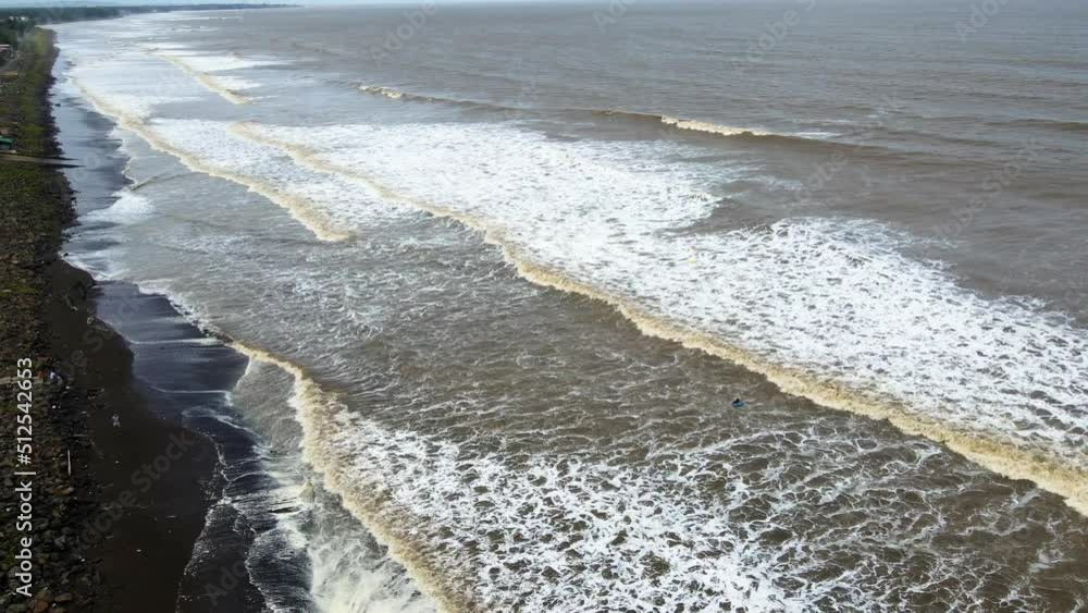 beach at vasi rajodi beach waves india mumbai maharashtra drone shot india birds eye view white water . beach at vasi rajodi beach waves india mumbai maharashtra drone shot india birds eye view white water .