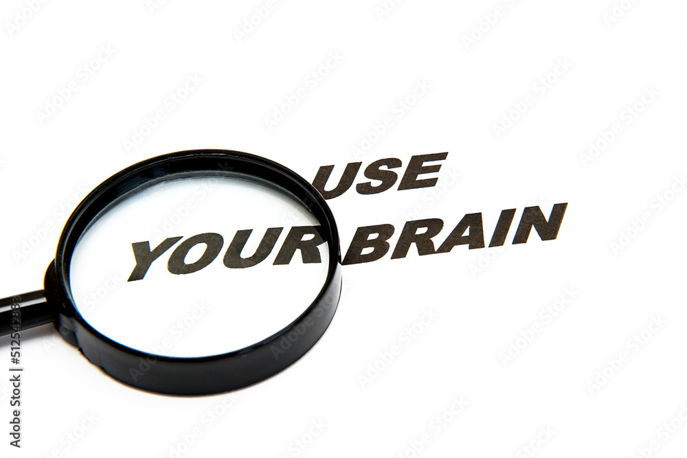 phrase use your brain on a white background next to a magnifying glass phrase use your brain on a white background next to a magnifying glass