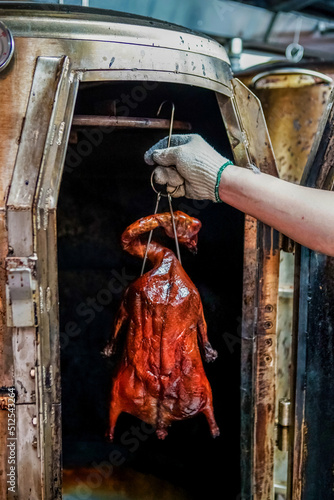 Take out a roast goose from the stove