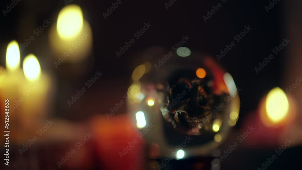 Silhouette of dark skull reflecting in magic crystal ball, witchcraft, horror Silhouette of dark skull reflecting in magic crystal ball, witchcraft, horror