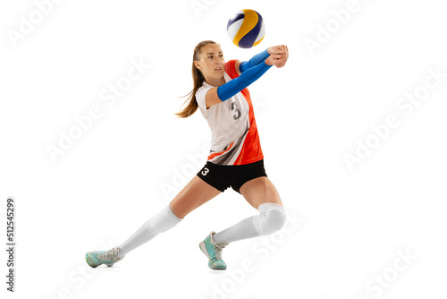 Female professional volleyball player in sports uniform training with ball isolated on white background. Action, sport, healthy lifestyle, team, fitness concept © master1305