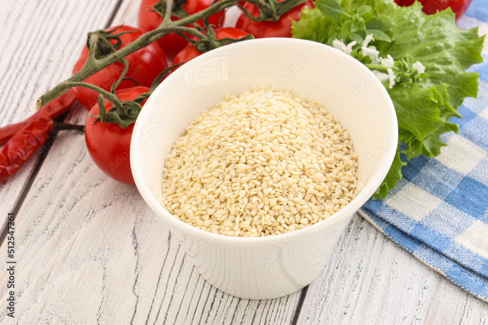 Raw sesame seeds in the bowl Raw sesame seeds in the bowl