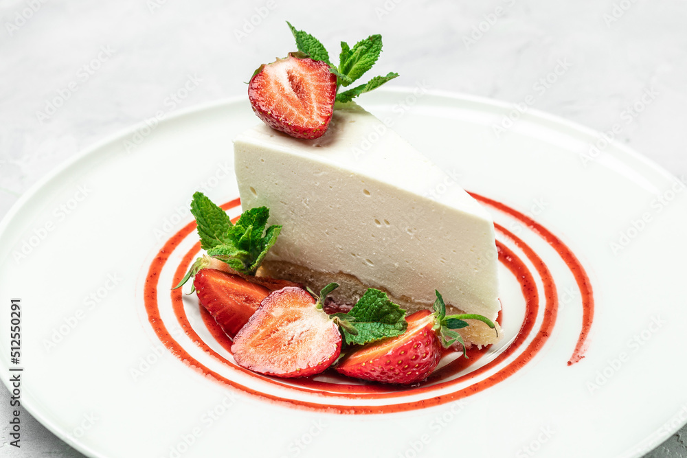 delicious homemade strawberry cheesecake with fresh strawberries, jam and mint