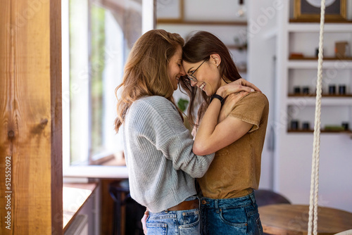 Canvastavla Happy affectionate lesbian couple at home