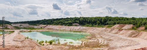 Panorama of small lake in the abandoned kaolin quarry photo