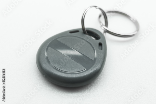 RFID tag key chain. Plastic cloned non-contact electronic radio key for intercom. NFC tag. Selective focus