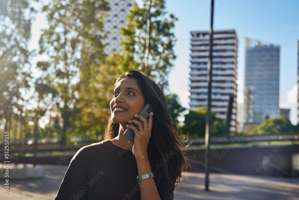 Young businesswoman with phone laughing on street Young businesswoman with phone laughing on street
