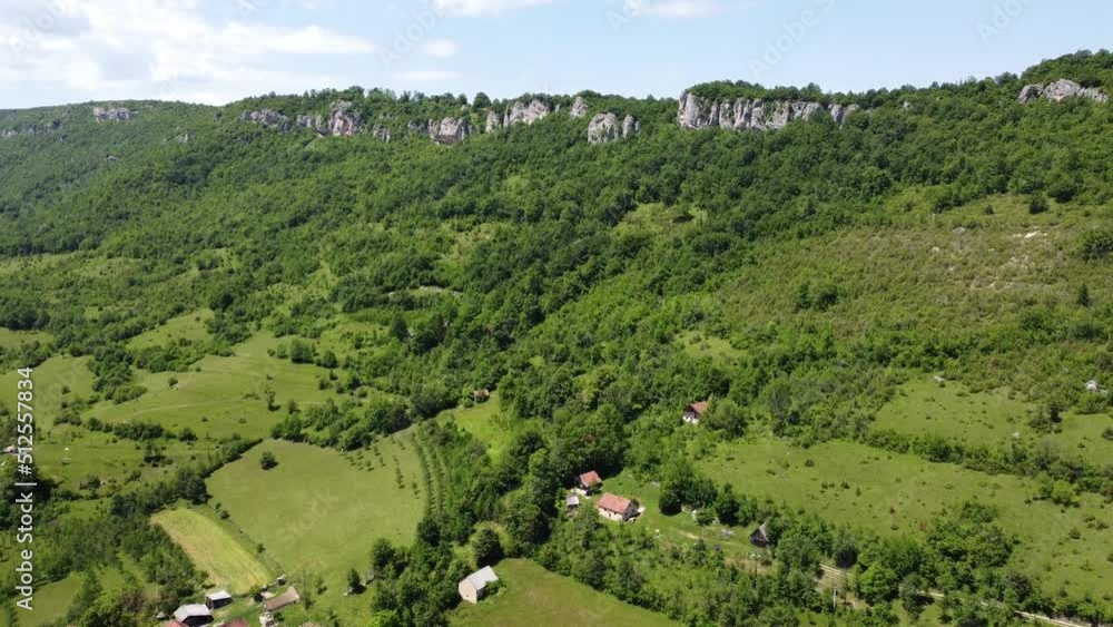 Green hills, fields and mountain in spring. Aerial drone view of nature in Bosnia and Herzegovina, Europe. Green hills, fields and mountain in spring. Aerial drone view of nature in Bosnia and Herzegovina, Europe.