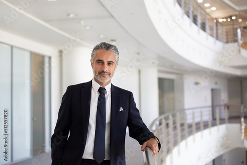 Portrait of Middle Eastern businessman in a modern corporate office atrium photo