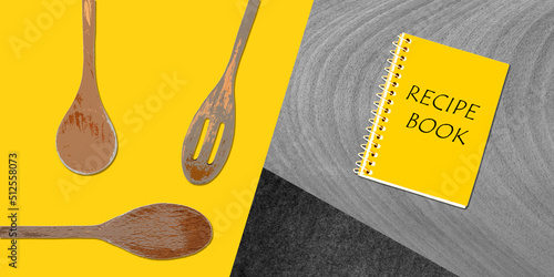 Topview of Set Cooking Wooden Utensils and Recipe Book on Colored Background