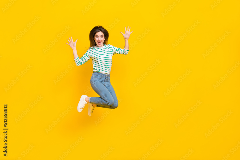 Full size photo of young charming ecstatic crazy girl jumping up enjoy summer vacation isolated on yellow color background Full size photo of young charming ecstatic crazy girl jumping up enjoy summer vacation isolated on yellow color background