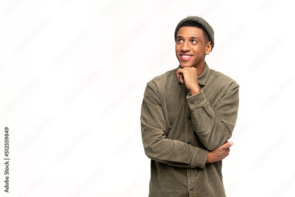 Portrait of happy satisfied handsome young man in shirt standing with crossed arms and looking away with toothy smile. Indoor studio shot on white background Portrait of happy satisfied handsome young man in shirt standing with crossed arms and looking away with toothy smile. Indoor studio shot on white background