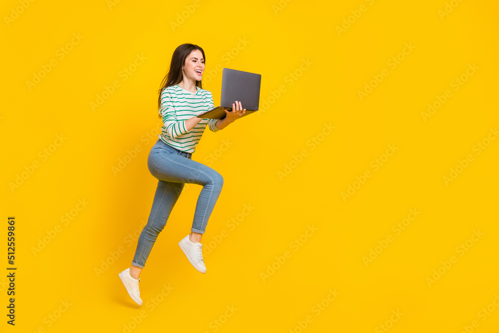 Leinwandbild Motiv - deagreez : Full size photo of good mood positive business lady search information in netbook isolated on yellow color background