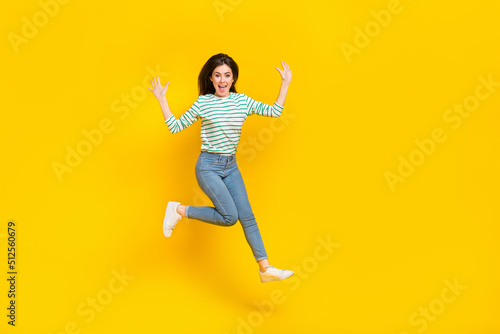 Full size photo of good mood cheerful lady traveling during summer vacation have fun isolated on yellow color background