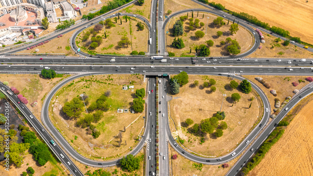 Aerial view of the Great Ring Junction in Rome, Italy. It's a long orbital motorway that encircles the city. Aerial view of the Great Ring Junction in Rome, Italy. It's a long orbital motorway that encircles the city.