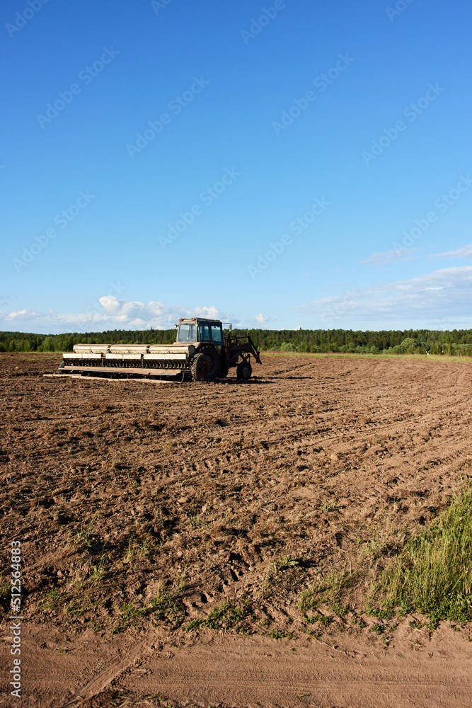 Fototapeta premium tractor working in the field