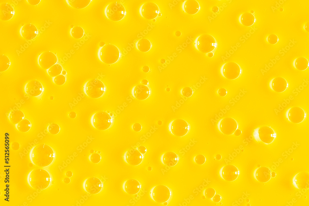 Bubble yellow texture background. Berry gel to cleanse the skin of the face and body. Spa treatments, skin care. Bath foam, detergent. Gold slime Bubble yellow texture background. Berry gel to cleanse the skin of the face and body. Spa treatments, skin care. Bath foam, detergent. Gold slime