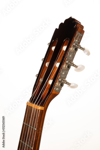 Classical guitar fretboard and machine head on a pure, brilliant white background