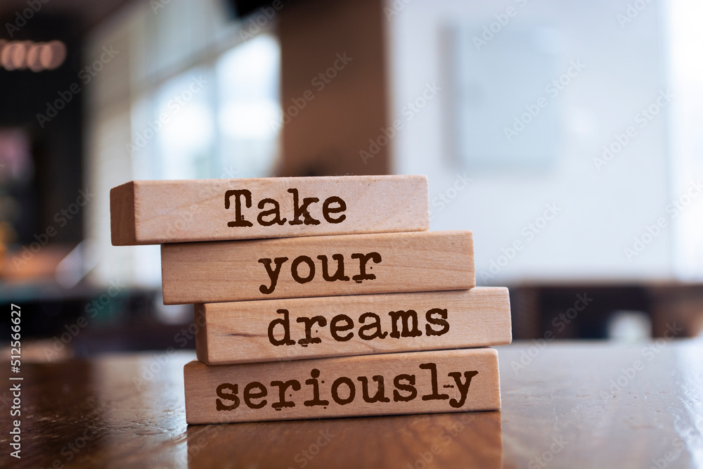 Wooden blocks with words 'Take Your Dreams Seriously'. Wooden blocks with words 'Take Your Dreams Seriously'.