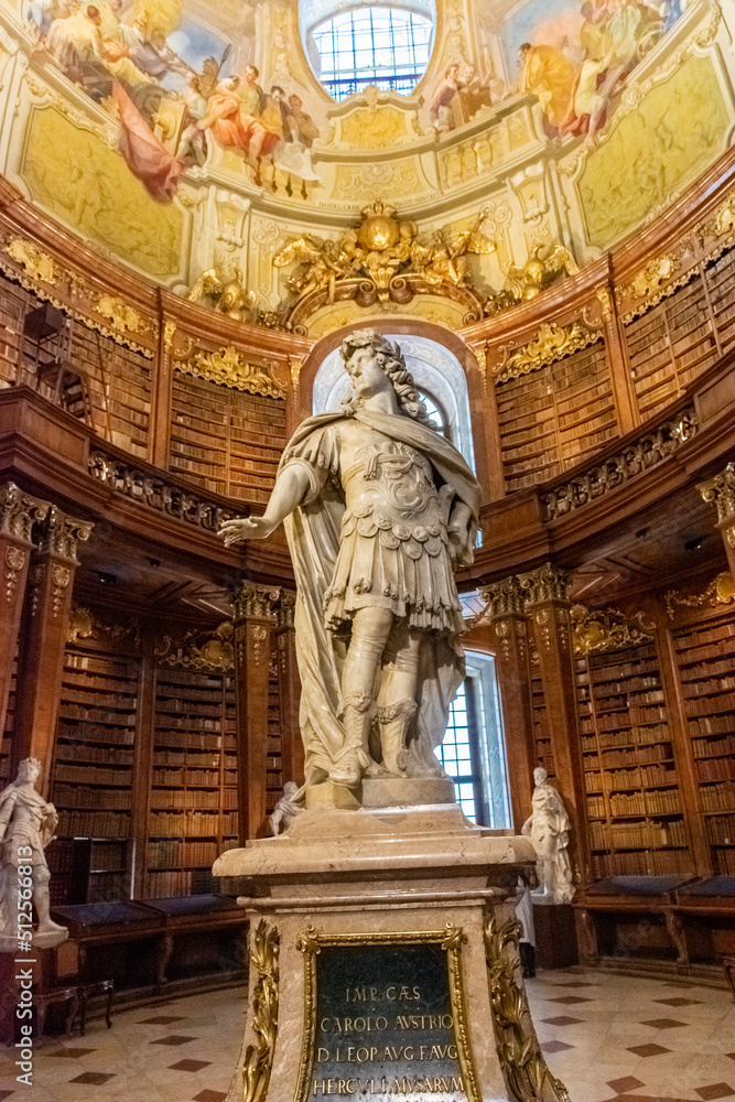 VIENNA, AUSTRIA, 19 FEBRUARY 2022: Interior of Austrian National Library - old baroque library of Hapsburg empire located in Hofburg Palace. Grand Hall with lot of books VIENNA, AUSTRIA, 19 FEBRUARY 2022: Interior of Austrian National Library - old baroque library of Hapsburg empire located in Hofburg Palace. Grand Hall with lot of books