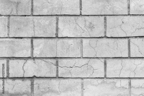 Old dirty white cracked brick texture wall damaged background broken