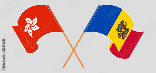 Crossed and waving flags of Hong Kong and Moldova