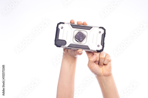 Typing on cell phone, child hand with smart phone isolated on white photo