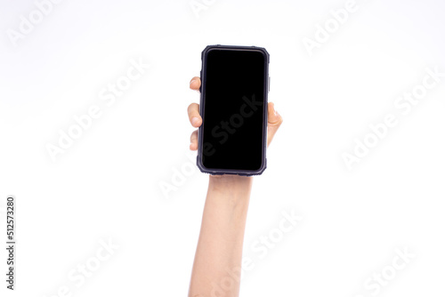 Blank screen with copy space, child hand with smart phone isolated on white photo