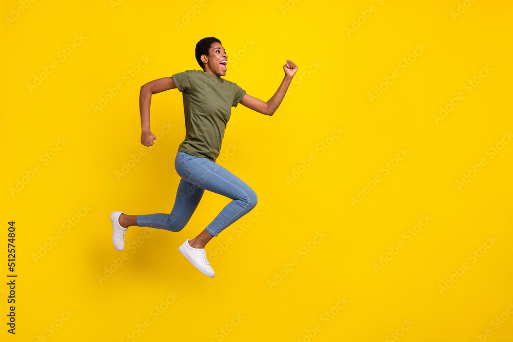 Full body portrait of crazy excited person look empty space jump rush isolated on yellow color background