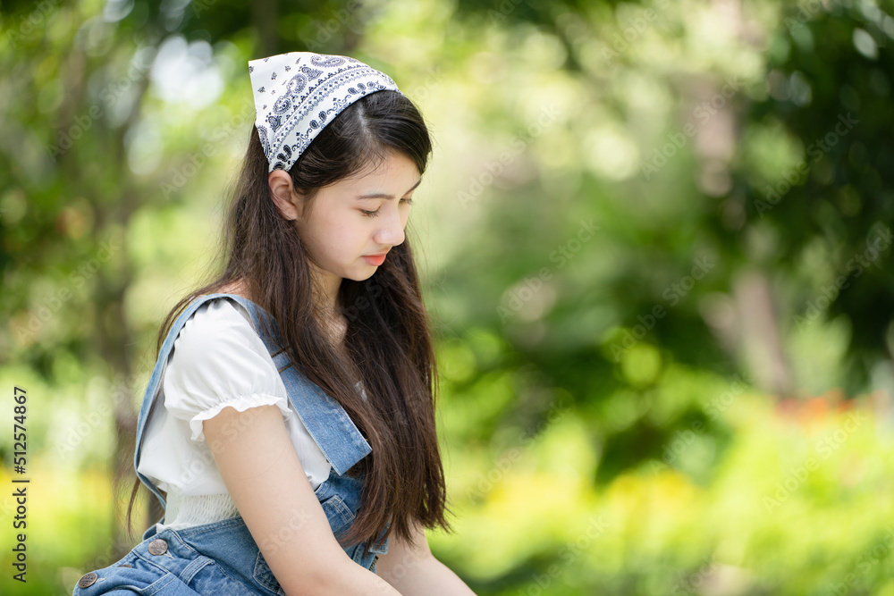 Photo portait smiling Girl in Green Park green city park in spring smiling dreamy, Smiling young brunette woman girl Photo portait smiling Girl in Green Park green city park in spring smiling dreamy, Smiling young brunette woman girl