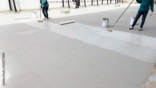 Bilde på lerret Repairman fixing a leaking roof or deck by applying waterproofing solution
