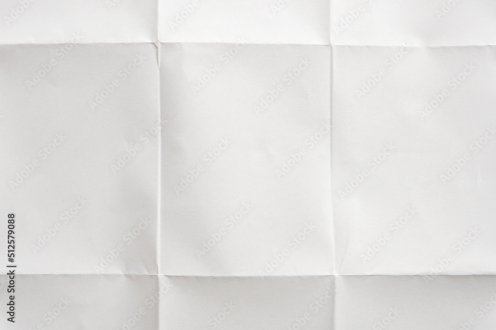 White folded and wrinkled paper texture background White folded and wrinkled paper texture background