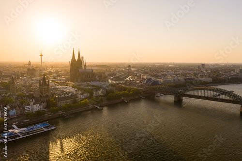 View of Cologne, city center, the Rhine river and Cologne Cathedral by sunset