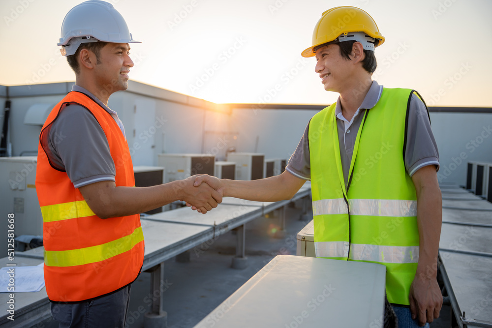 Construction worker team hands shaking greeting start up plan new project contract in office center at construction site, partnership and contractor concept.. Construction worker team hands shaking greeting start up plan new project contract in office center at construction site, partnership and contractor concept..