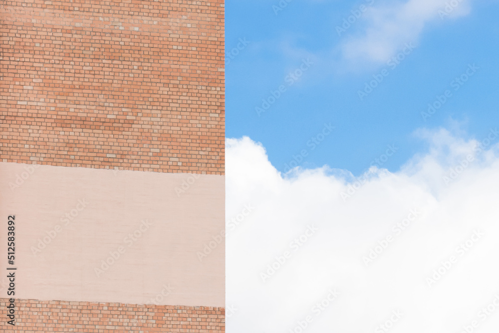 Old city building of brick facade, space for text, design, empty mock up on the wall template blank background blue sky