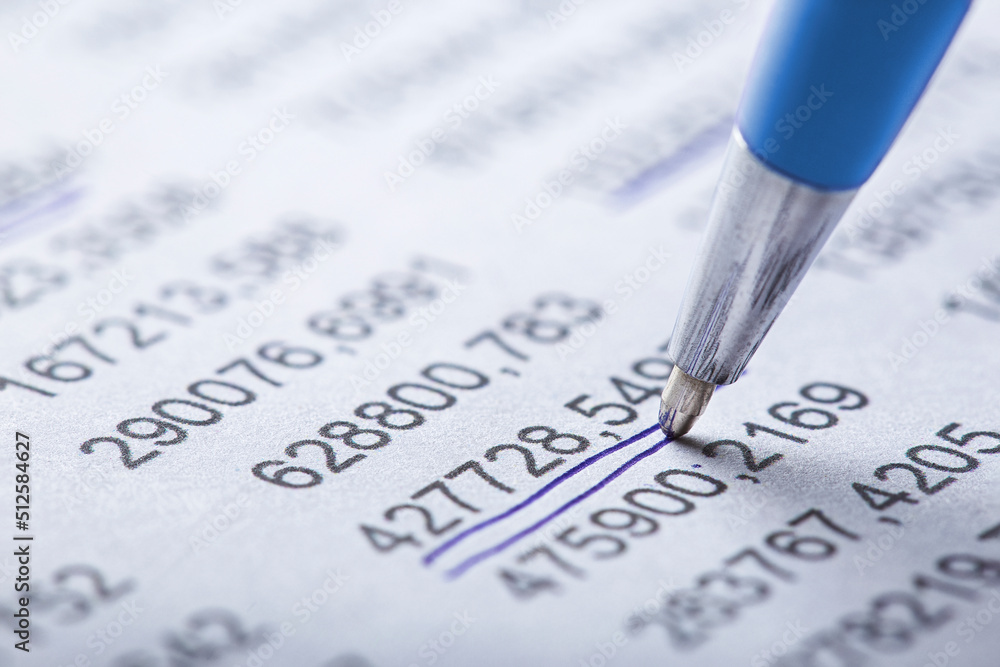 Accounting document with pen, money, coins and checking financial chart. Concept of banking, financial report and financial audit. Accounting document with pen, money, coins and checking financial chart. Concept of banking, financial report and financial audit.