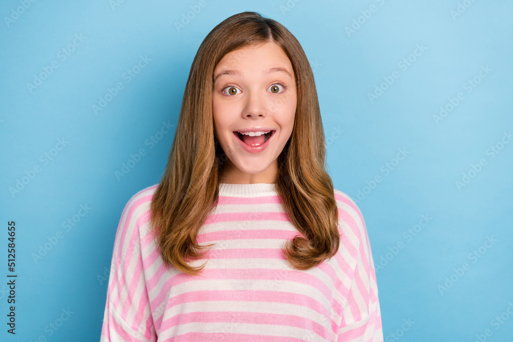 Photo of cute teen girl open mouth wear white shirt isolated on blue color background Photo of cute teen girl open mouth wear white shirt isolated on blue color background