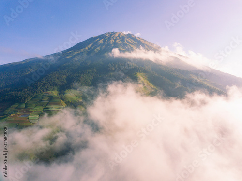 The peak of the Mount Sumbing with sea of clouds and blue sky. Central Java  Indonesia