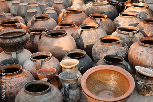 Old traditional clay pots. Old traditional pottery. Ancient clay pots of Ukrainian culture.