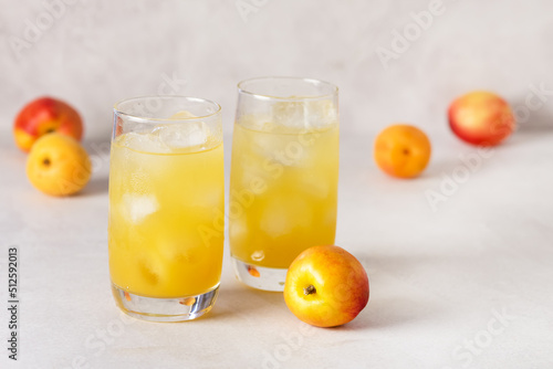 Delicious Peach Lemonade made with Soda Water on Gray Background Tasty Beverage Copy Space
