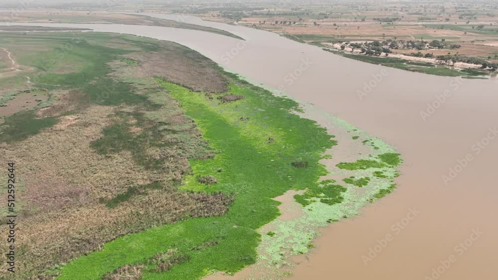 An aerial view of a river along with it's green banks which gives a pleasure to viewer's eye An aerial view of a river along with it's green banks which gives a pleasure to viewer's eye