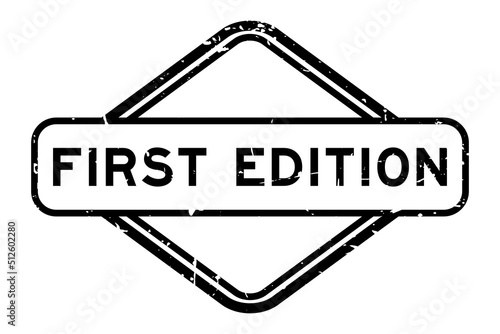 Grunge black first edition word rubber seal stamp on white background