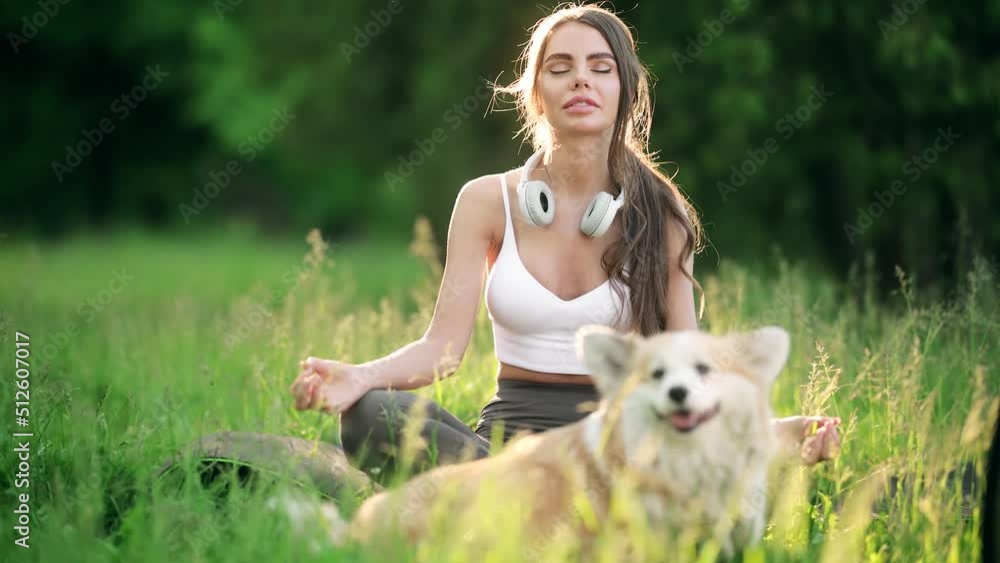 Woman practicing yoga outdoors. Yoga in the park. Relax in nature Woman practicing yoga outdoors. Yoga in the park. Relax in nature